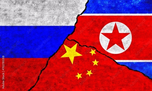 China, Russia and North Korea painted flags on a wall with a crack. China, North Korea and Russia conflict
