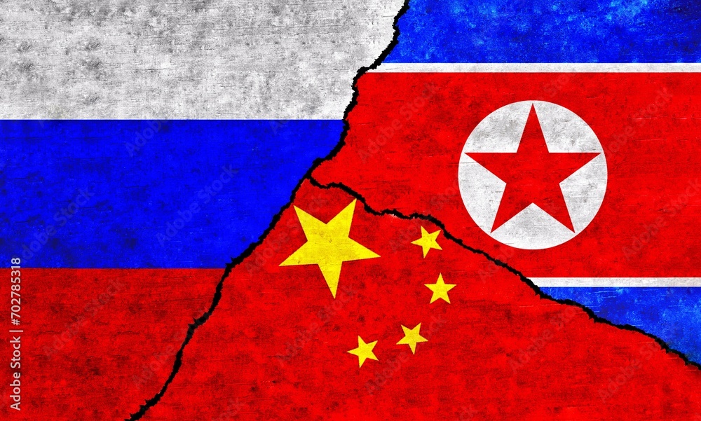 China, Russia and North Korea painted flags on a wall with a crack. China, North Korea and Russia conflict